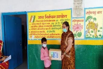 Each happiness kit contains essential grocery and academic necessities