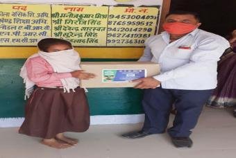 A parent visits school to collect a happiness kit