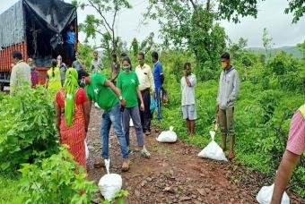 Volunteers ensuring every person receives a kit