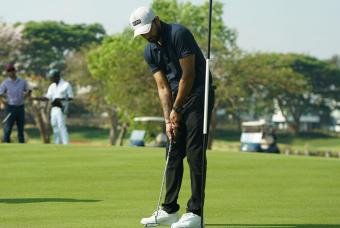 Poised for a perfect swing, with eyes on a great mission