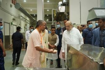 Inspecting how soft the hot chapathis are