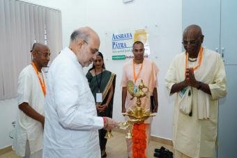 Lighting of the ceremonial lamp to begin the inauguration ceremony