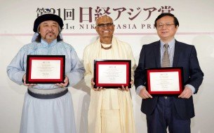 From left: Nikkei Asia Prizes recipients, Mr. Dogmid Sosorbaram, Shri Madhu Pandit Dasa and Mr. Jiang Lei at the award ceremony in Tokyo