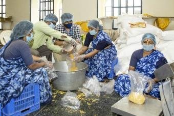 Packing all raw materials for the grocery kits to be distributed.