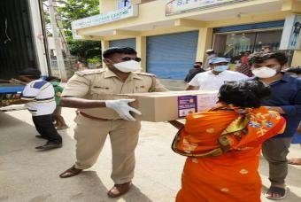 Another needy person receives the grocery kit.