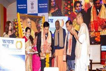 The Chief Guest lighting the ceremonial lamp