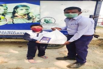 A son does his duties - receives a grocery kit to support the family